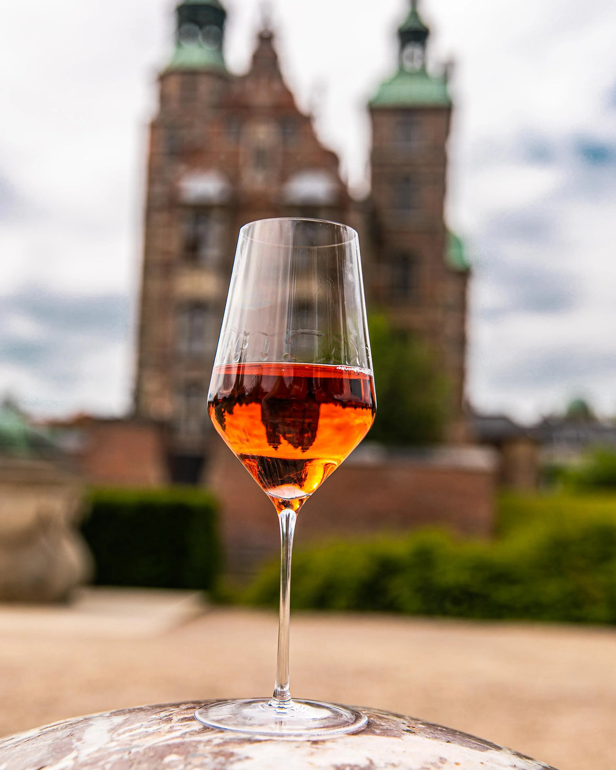 Zalto White Wine glass of rosé wine in front of a historic castle