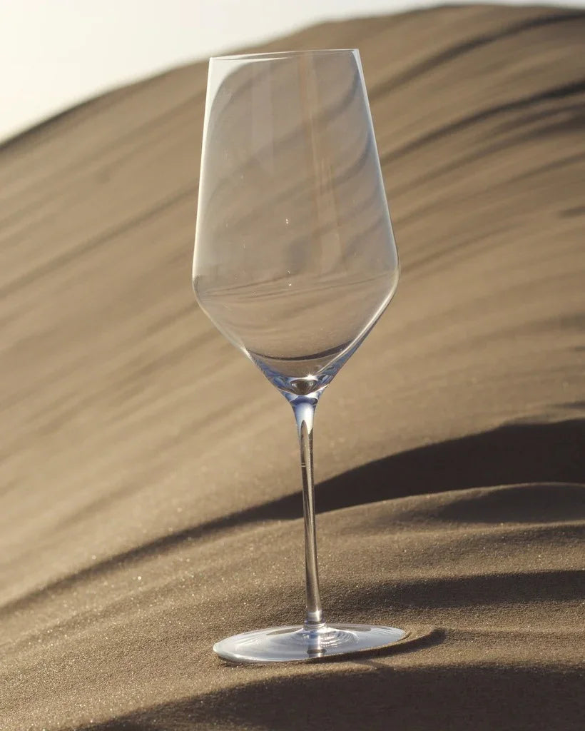 Zalto White Wine glass standing on a sand dune